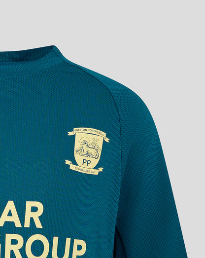 Close-up of left chest showing the club crest on teal Preston Junior training T shirt