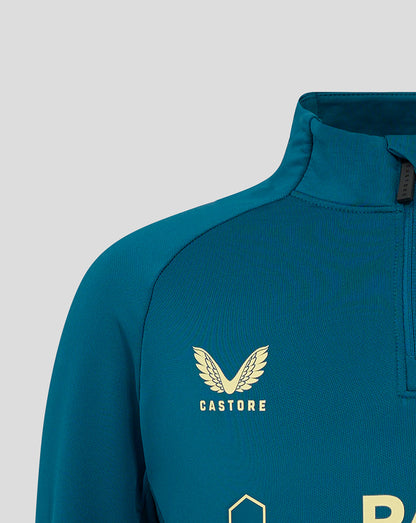Close up of blue quarter zip training top collar showing crest on chest and Castore branding