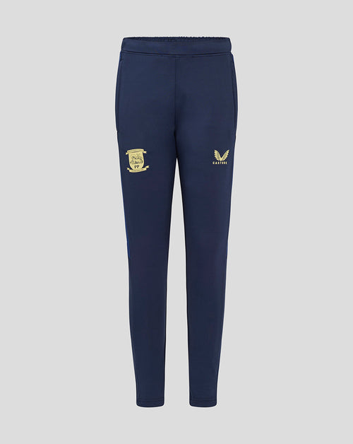 Back view of navy junior Preston North End training pants with pockets and crest on the left thigh and Castore logo on the right thigh