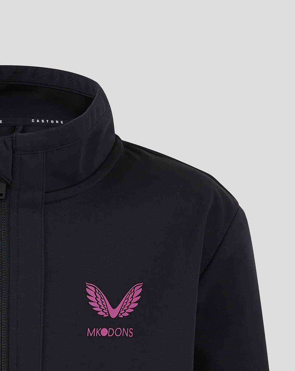 Close up of black Mk Dons Junior travel jacket with pink wings logo on the chest