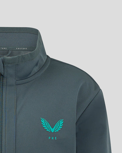 Close up of collar and left chest showing Castore branding and PNE crest on teal travel jacket