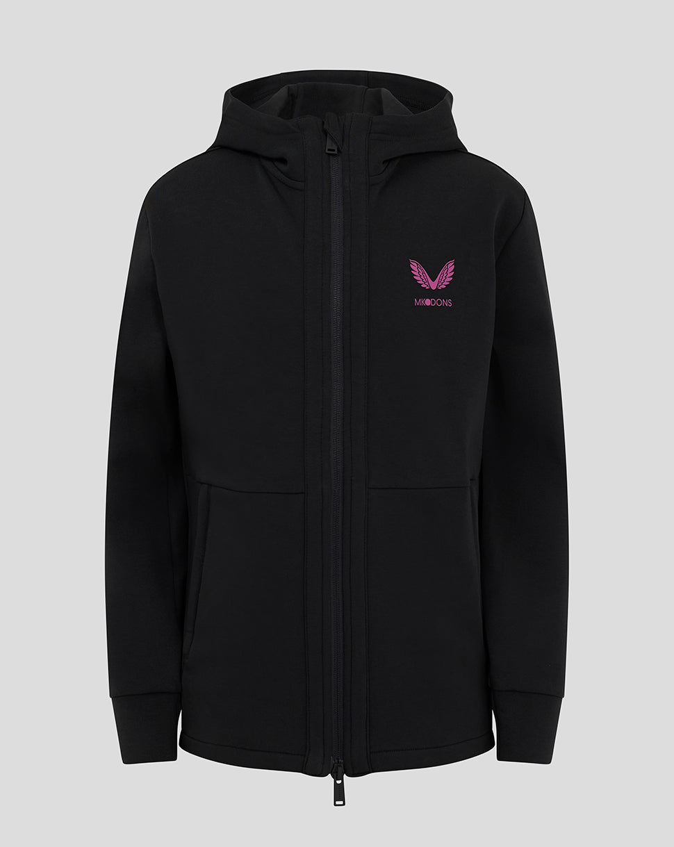 Front view of black Mk Dons junior hooded travel jacket with a pink crest logo on the chest and full zip