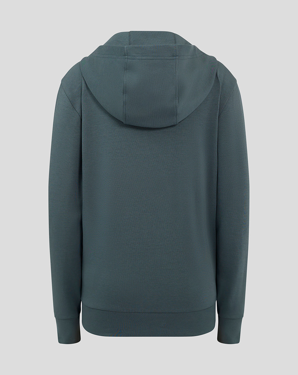 Back view of the dark teal Preston Junior hooded travel jacket showing the hood and ribbed hem