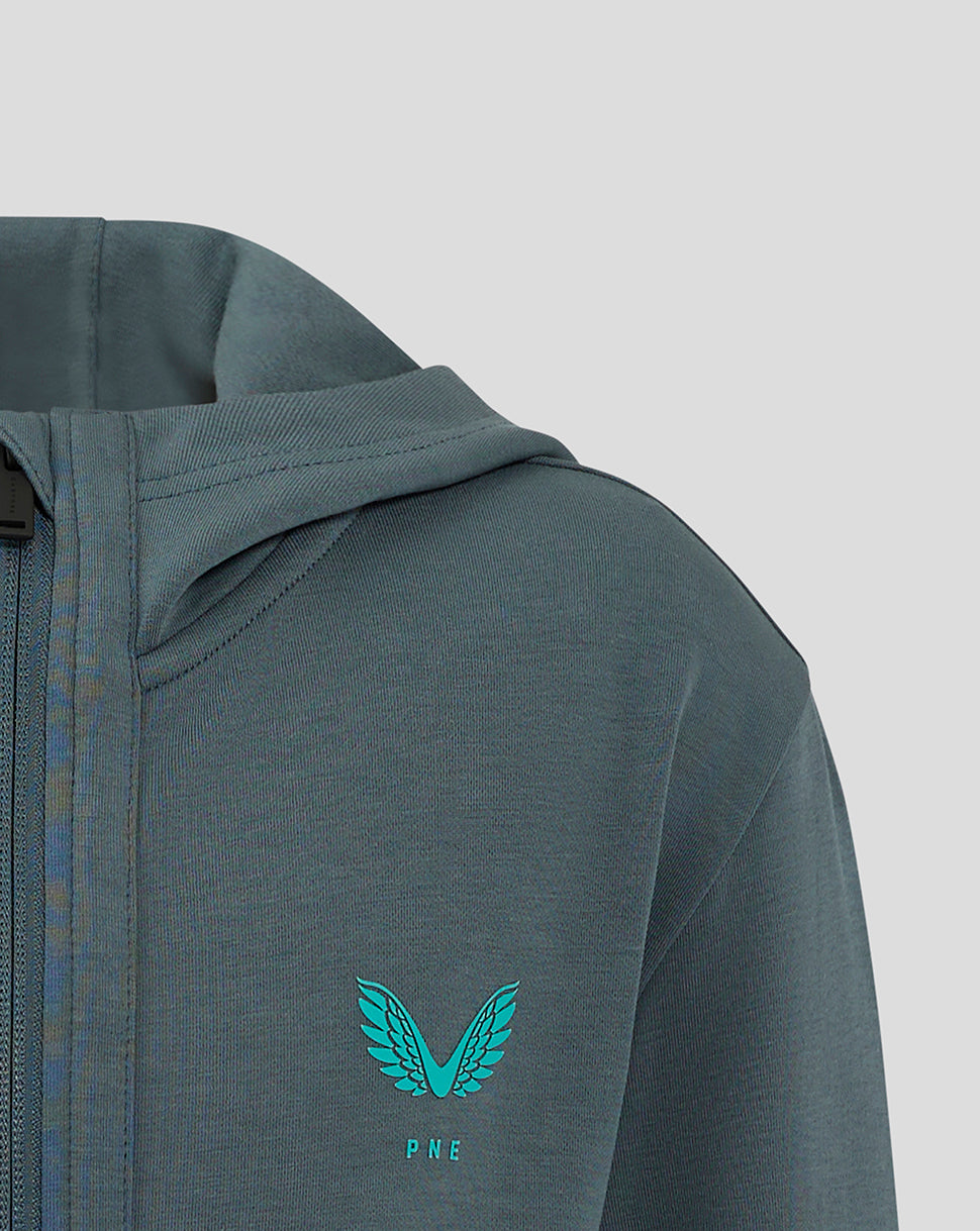 Left chest teal Castore wings logo with PNE lettering on the dark teal Preston Junior hooded jacket
