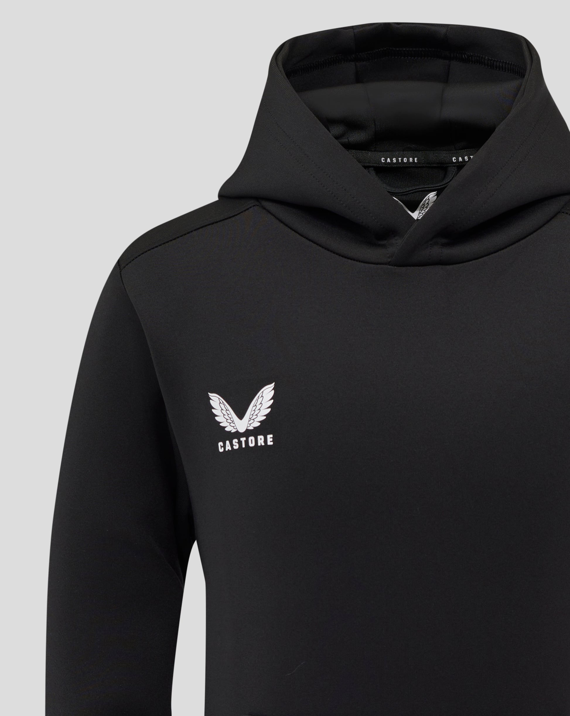 Black hoodie chest with white Castore logo and wing emblem.