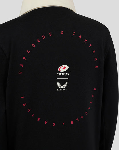 Back view of black jersey showing circular red text around a central crest and Castore wings