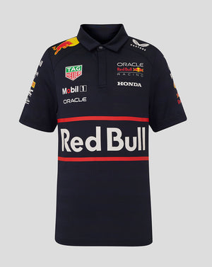 Front view of navy Oracle Red Bull Racing junior polo shirt with large Red Bull logo and sponsor decals