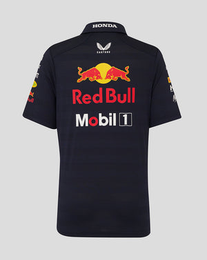 Back view of navy junior polo shirt with large Red Bull emblem across the upper back and sponsor logos