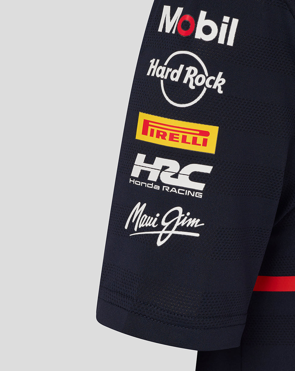 Navy junior team polo sleeve close-up with sponsor logos Mobil, Hard Rock, Pirelli, Honda Racing and Maui Jim
