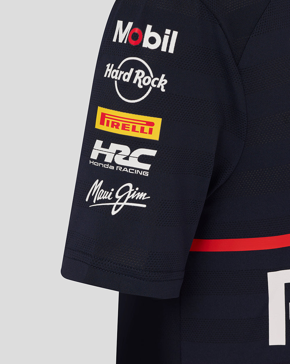 Close-up of a navy Oracle Red Bull Racing junior T shirt sleeve with Mobil Hard Rock Pirelli Honda Racing and Maui Jim logos