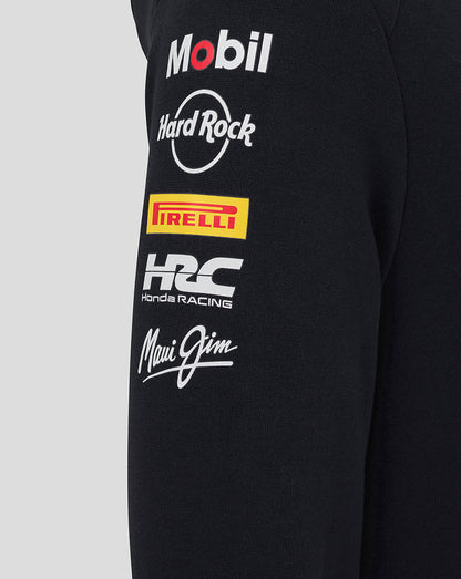 Left sleeve of black Junior Teamline hoodie adorned with sponsor logos including Mobil Hard Rock Pirelli Honda Racing and Maui Jim.