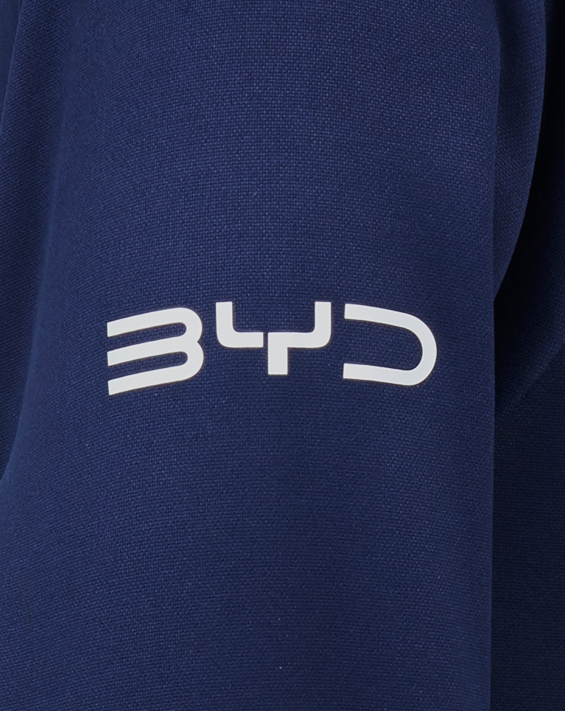 Close up of navy fabric from the Sydney Roosters 2025 Junior Pro Players Hoodie with white lettering visible at the bottom.