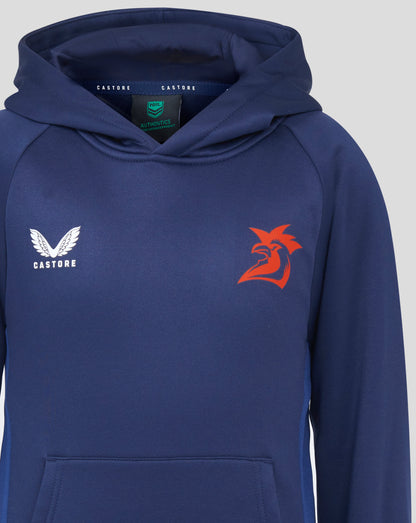 Front view of navy Sydney Roosters hoodie featuring white Castore logo on left chest and red rooster graphic; hood interior shows NRL Authentics label