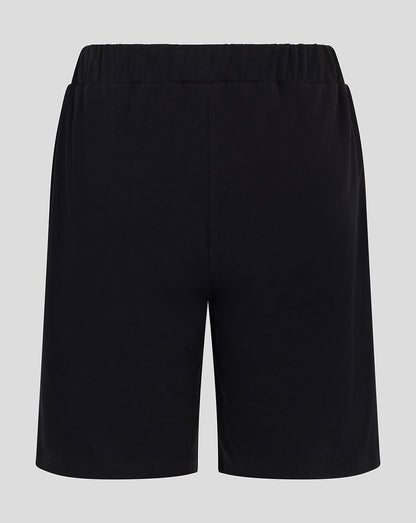 Back view of Harlequins Youth black shorts with elastic waistband
