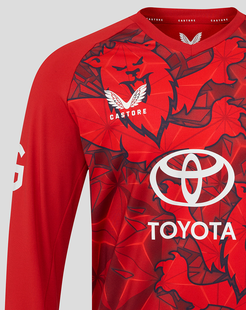 Close-up of the red England Cricket T20 sweater front with Toyota sponsor logo and England crest.