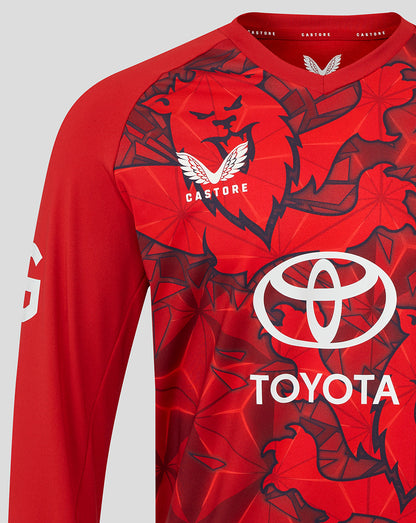 Close-up of the red England Cricket T20 sweater front with Toyota sponsor logo and England crest.