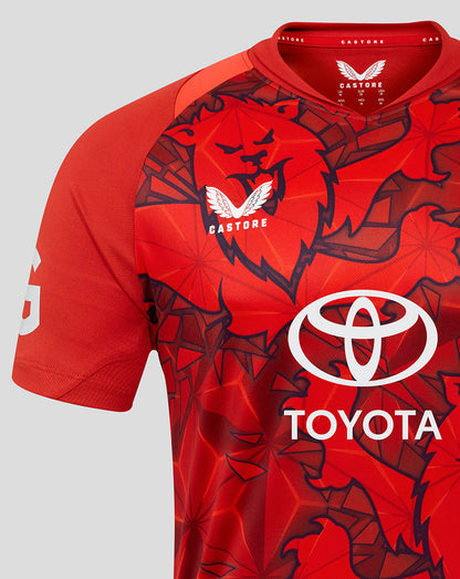Close-up of red T20 shirt fabric and pattern with Toyota logo on the chest