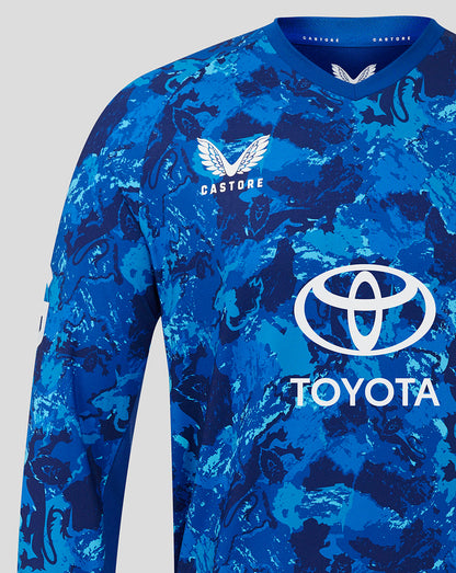 Chest area of blue camouflage England cricket ODI sweater with Castore emblem on left and Toyota logo across front.