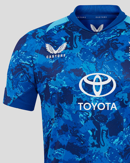 Close up of England ODI short sleeve cricket shirt showing blue camouflage pattern and Toyota sponsor across front