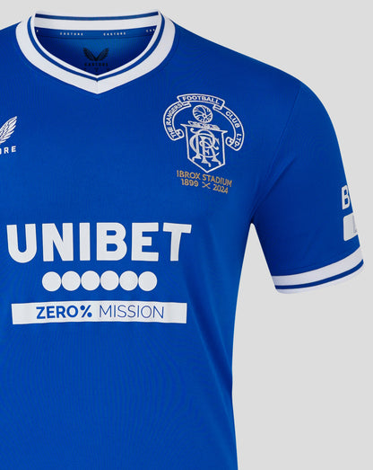 Close up of blue Ibrox 125 Heritage shirt collar with white trim and crest on the chest