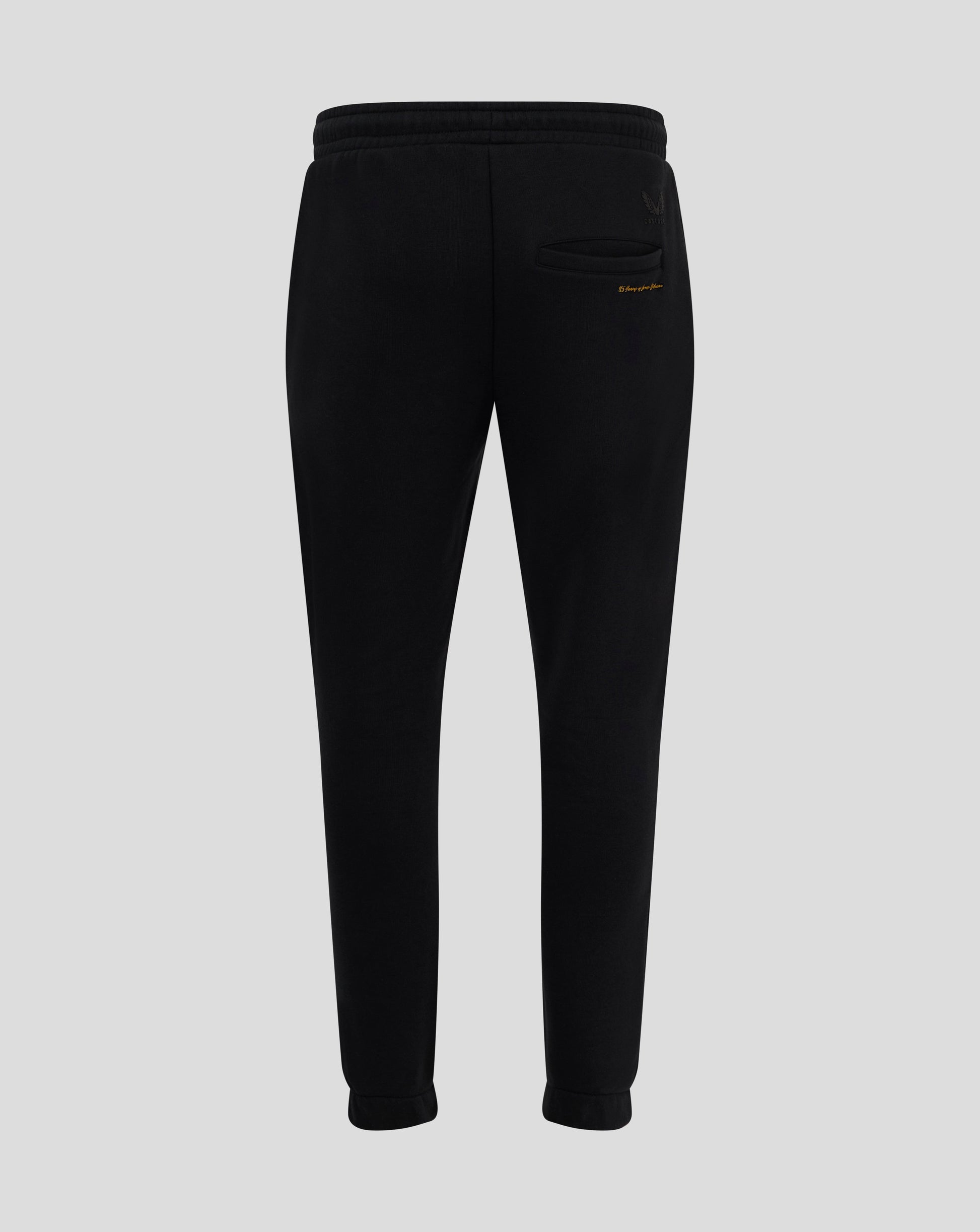 Back view of black Rangers FC Ibrox 125 Heritage joggers showing welted back pocket and Castore logo with gold text beside pocket