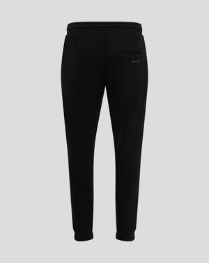 Back view of black Rangers FC Ibrox 125 Heritage joggers showing welted back pocket and Castore logo with gold text beside pocket