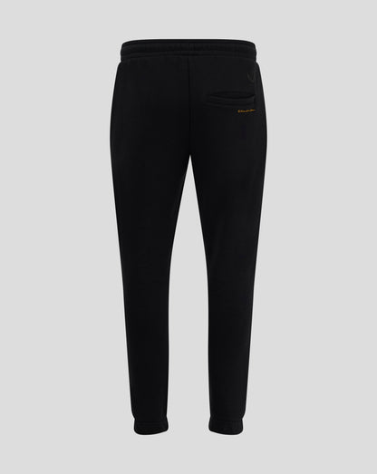 Back view of black Rangers FC Ibrox 125 Heritage joggers showing welted back pocket and Castore logo with gold text beside pocket