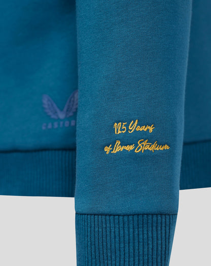 Close-up of blue Rangers sweatshirt hem showing gold 125 Years embroidery and partial crest