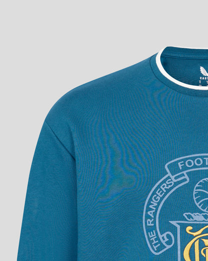 Close-up of blue crewneck neckline with white trim and a partial chest crest