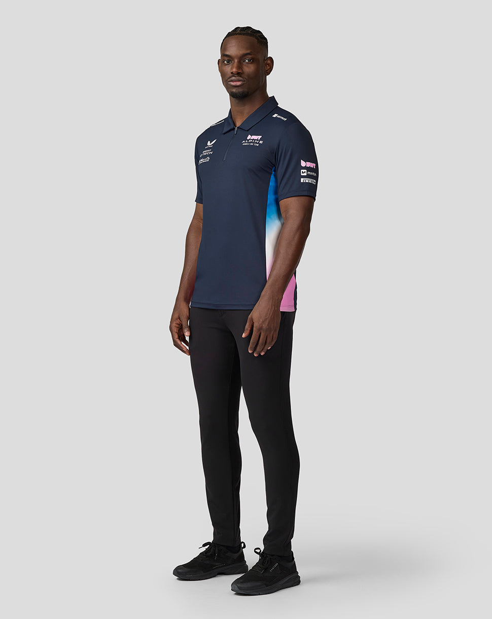Three quarter view of navy BWT Alpine polo showing chest branding and gradient side panel.