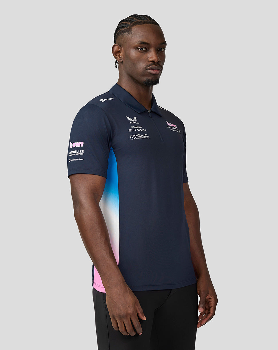 Male model wearing navy BWT Alpine Formula One Team polo with logos on chest and sleeve