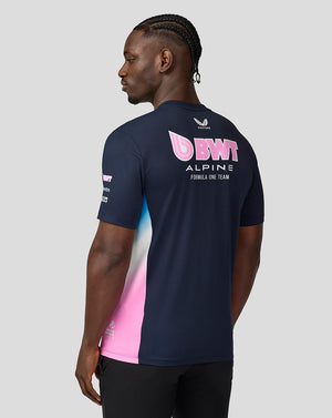 Rear view of a man in navy BWT Alpine Set Up T Shirt showing large pink BWT logo on back.