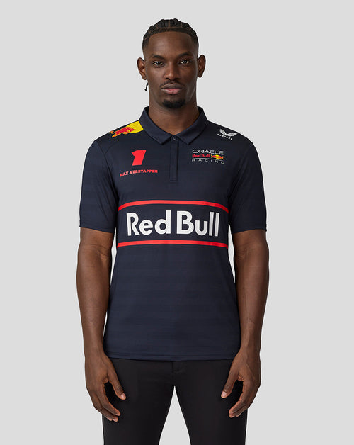 Front view of a male model wearing Night Sky navy Oracle Red Bull Racing polo with large Red Bull logo and Verstappen graphics