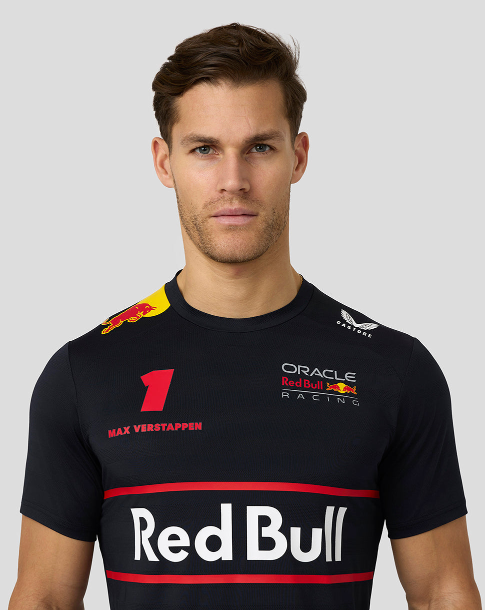 Close up of a model wearing a black Night Sky Red Bull Racing T-shirt with Verstappen number 1 on the chest.