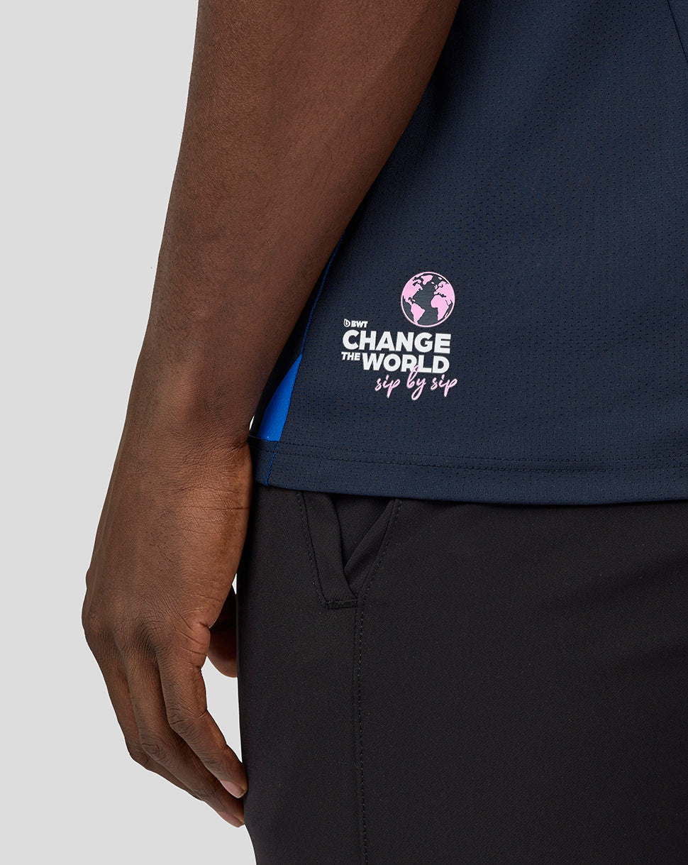 Side view of navy Pierre Gasly driver jersey showing sponsor logos on the sleeve and Change the World graphic on the lower back.