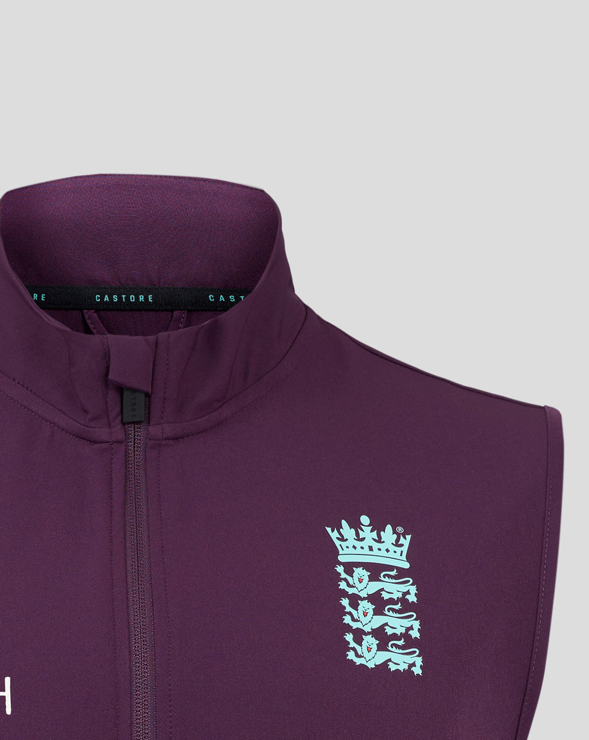 Close-up of England Cricket Men's 25/26 Training Gilet neckline in purple showing team crest and Castore branding