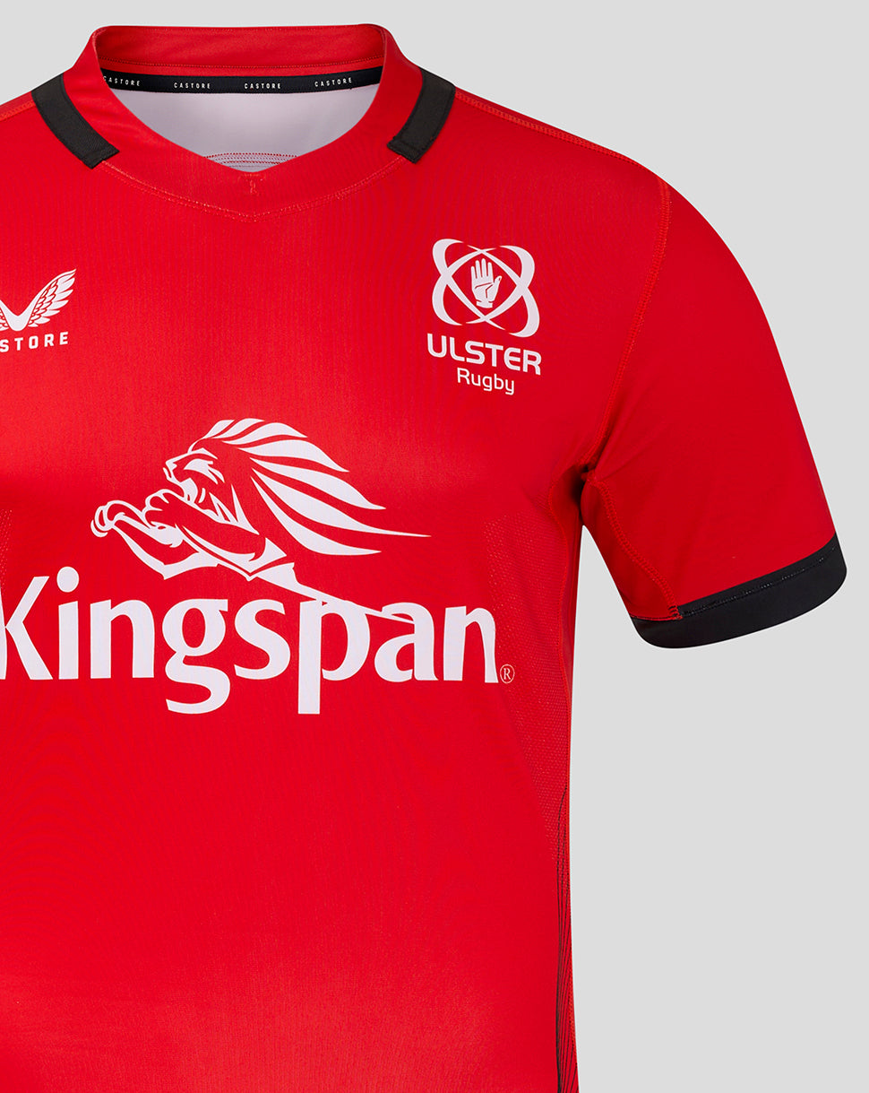 Close up of red jersey front showing Ulster Rugby crest and branding on the chest