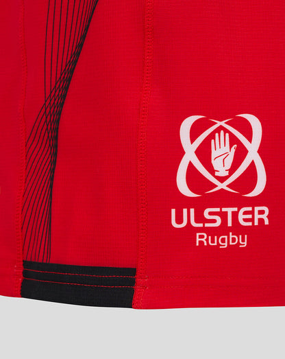 Close-up of red Ulster Rugby Pro Shorts fabric with white logo and visible stitching details.
