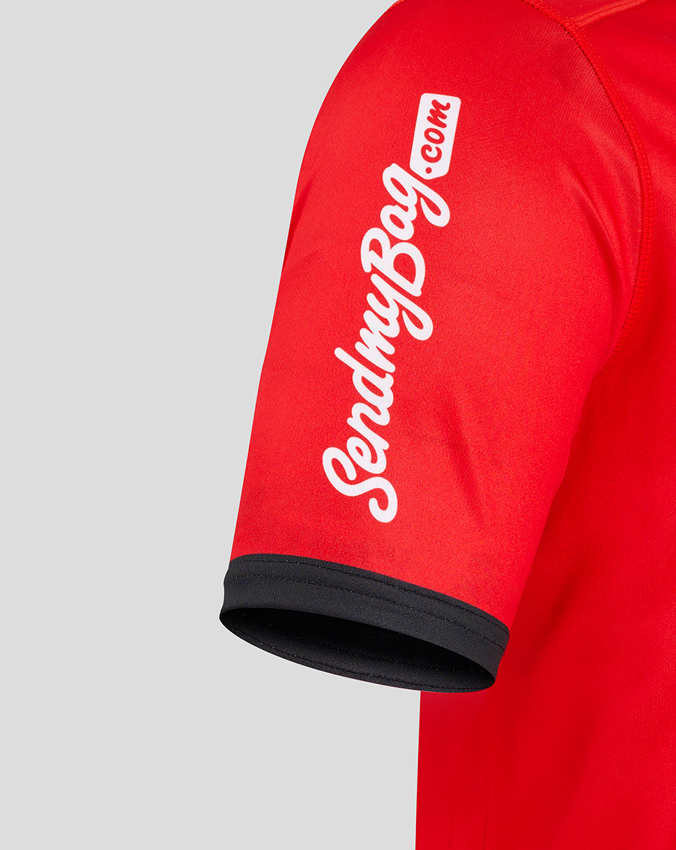 Red Ulster away shirt sleeve with black cuff and diagonal white branding along the sleeve