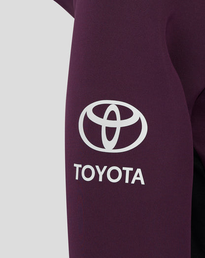 Close up of the chest area on the maroon England hoodie showing a white Toyota logo