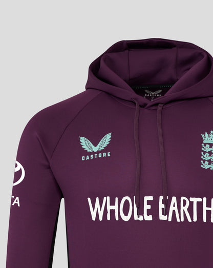 Close up of the chest featuring bold WHOLE EARTH text and a crest graphic on the maroon hoodie