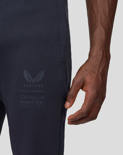 Side view of navy jogger with stitched pocket seam and faint Castore Oracle Red Bull Racing branding.