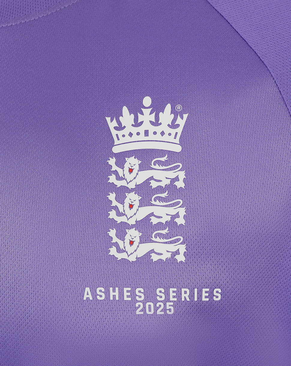 Close up of purple England Ashes shirt chest displaying crown crest and Ashes Series 2025 text.