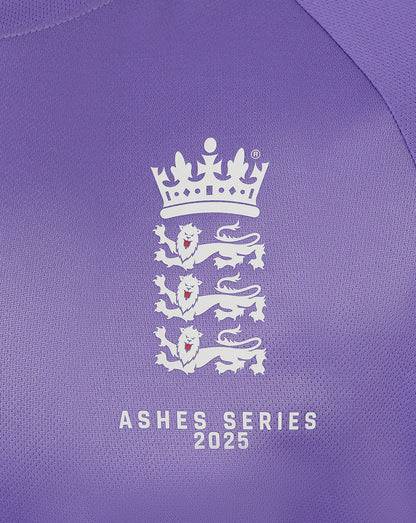 Close up of purple England Ashes shirt chest displaying crown crest and Ashes Series 2025 text.