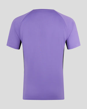 Back view of the purple junior Ashes training tee with black side panels.