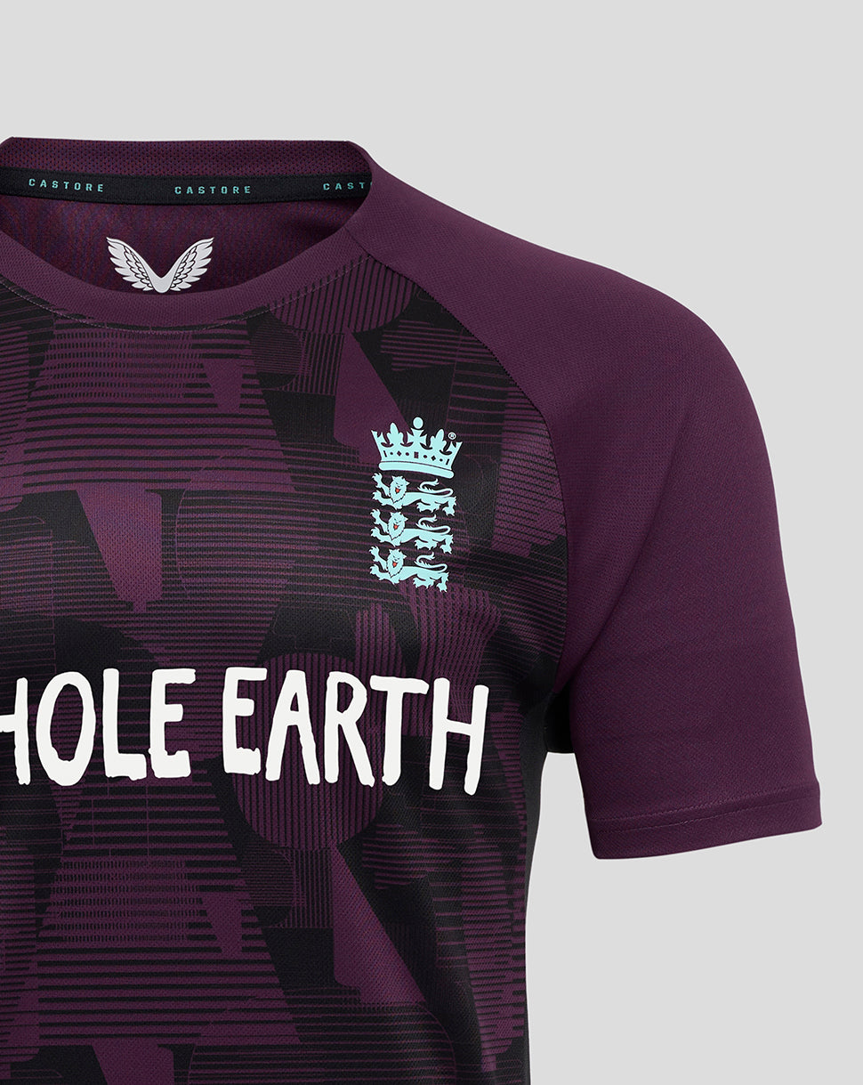 Purple sports jersey with a logo and 'Whole Earth' text on a gray background