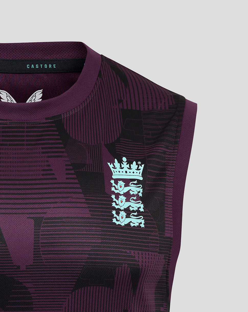 Chest detail of purple England training vest with abstract pattern and light blue national crest