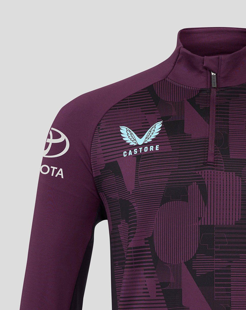 Close up of maroon England cricket training top showing Castore wing logo and England crest on the chest with a geometric pattern