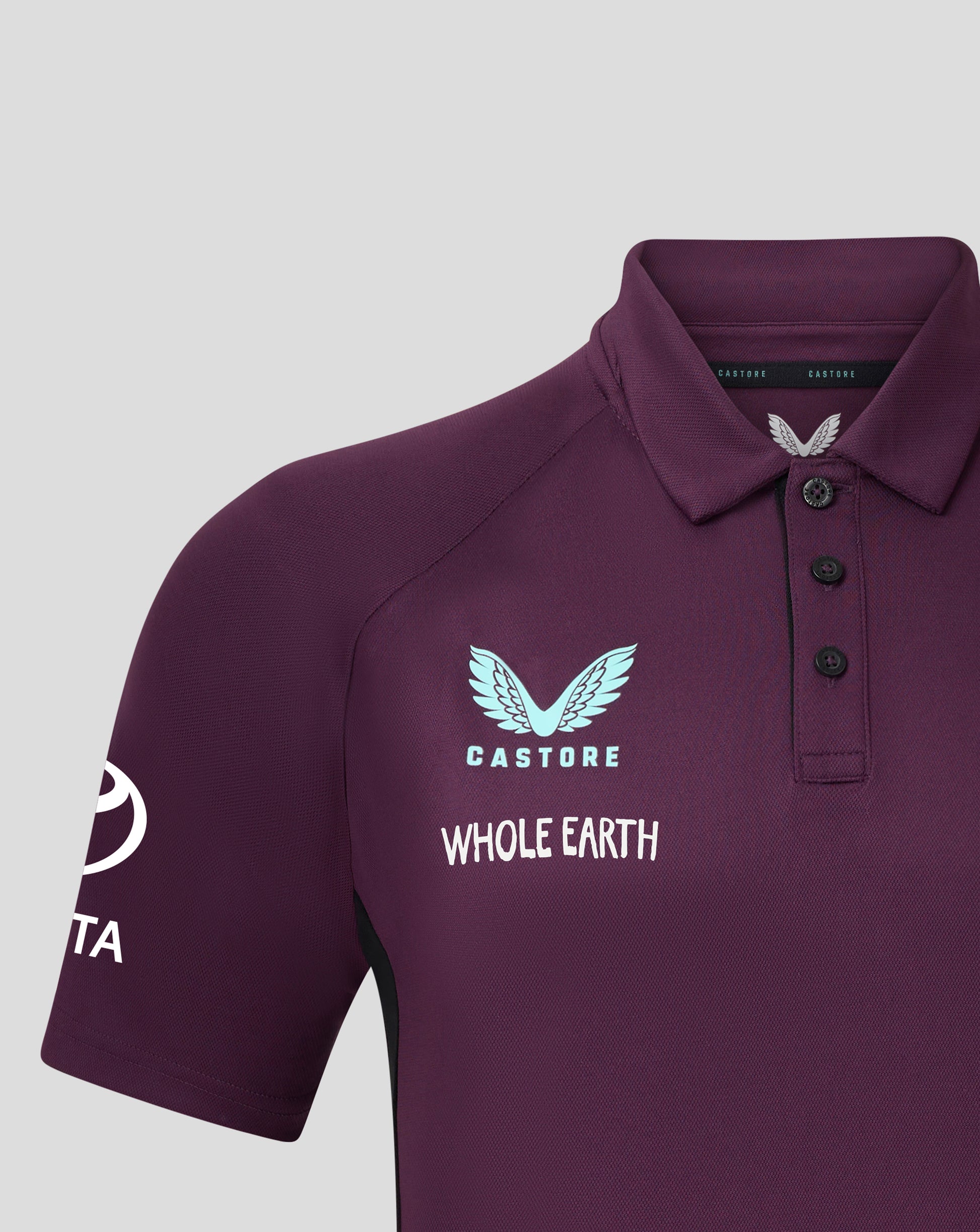 Close up of the polo collar on a maroon England cricket shirt with a Castore label inside and a pale emblem on the chest
