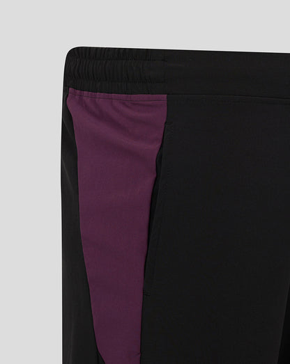 Close-up of black England cricket training shorts showing a purple side panel and flat front waistband